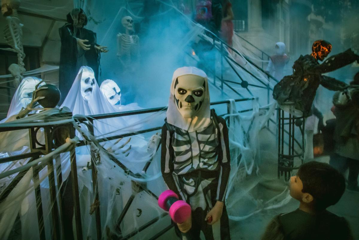 photo of kid in skeleton costume