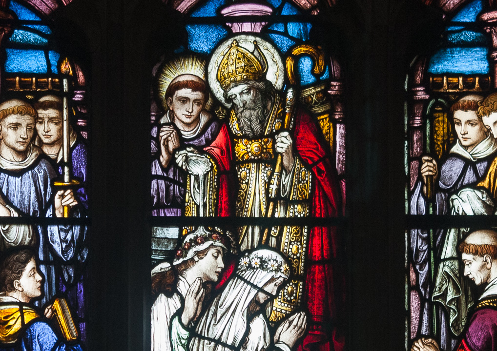 stained glass window depicting St. Patrick baptizing Irish pagans