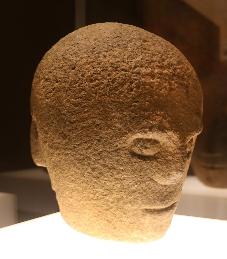 The Corleck Head, a carved stone head with three-faces that is associated with the Lughnasadh. 1st or 2nd century AD. (Collections of the National Museum of Ireland, Kildare Street)